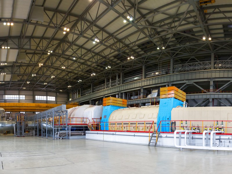 Powerful steam turbine in the turbine hall of the nuclear power plant